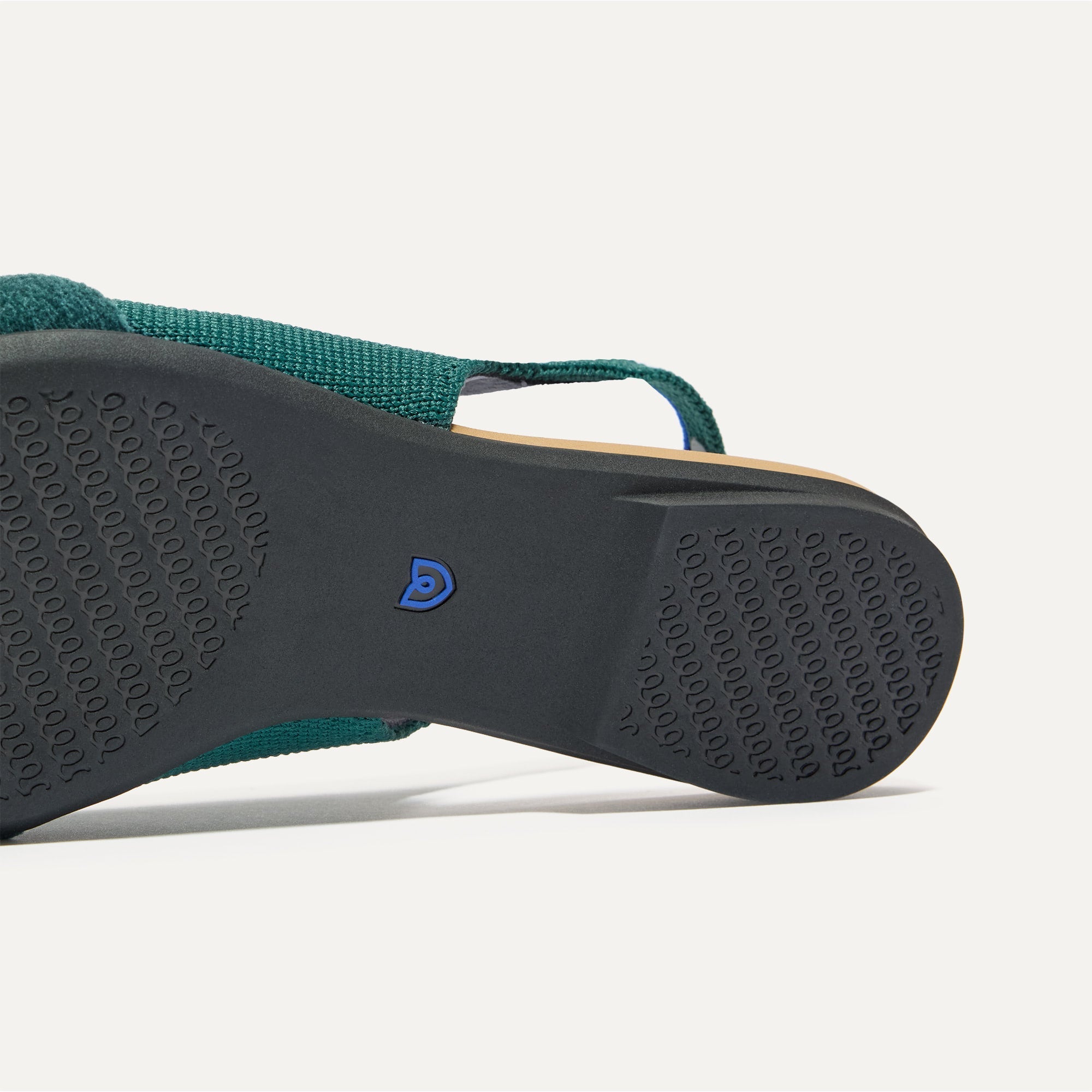 Close up of the outsole of The Twist Point Slingback in Everglade.