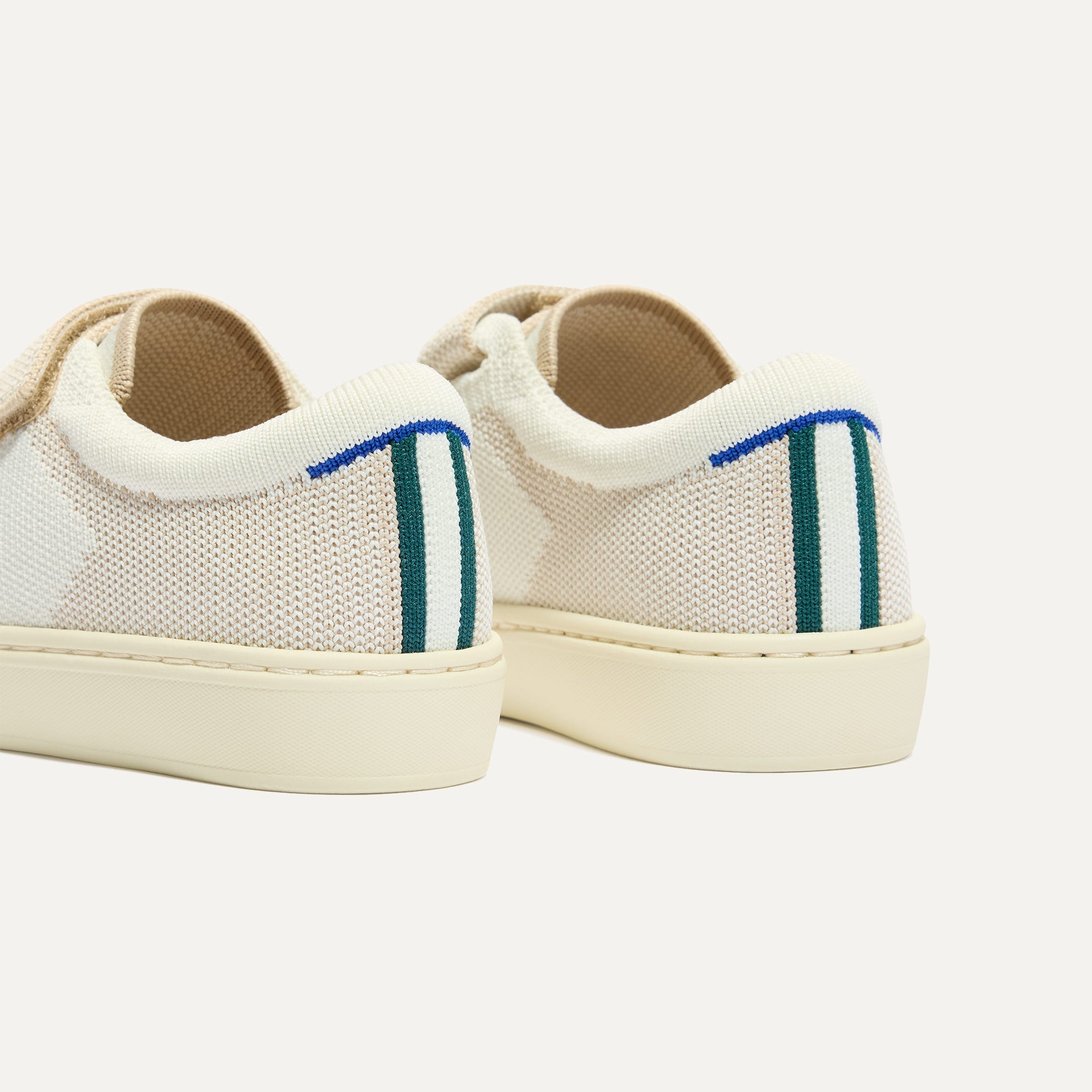 Close up of the heel of The Kids Strap Sneaker in Vanilla Ice, with Rothy's signature blue halo. 