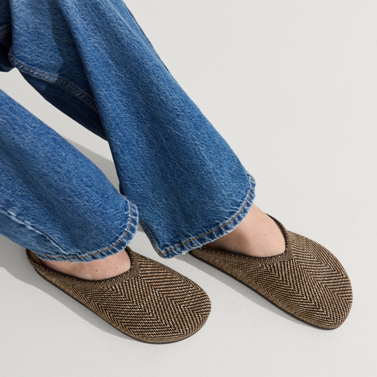 hover | Model wearing The Casual Clog in Spice Herringbone.