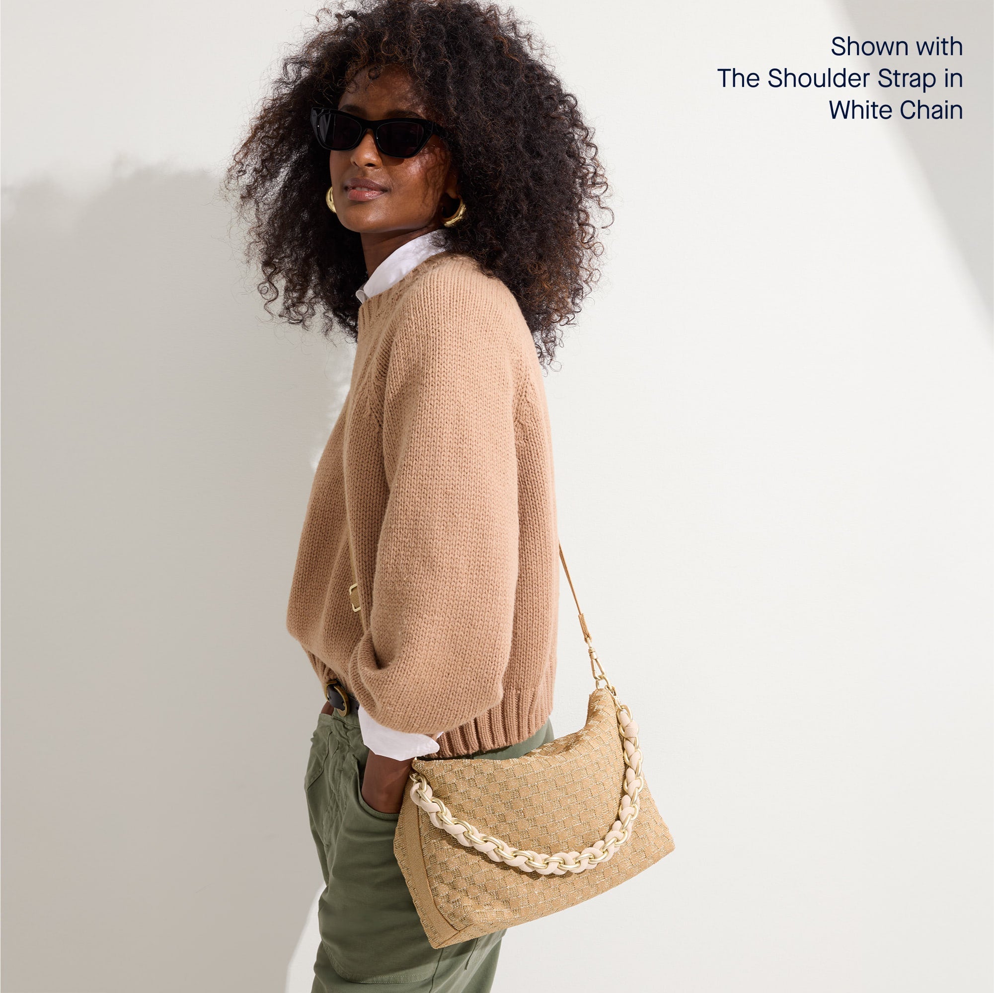hover | The Daily Crossbody in Golden Sun, carried over the shoulder of a female model, shown from the right.