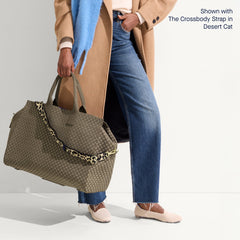 hover | The Weekender in Safari Green shown on model shown paired with The Crossbody Strap in Desert Cat.